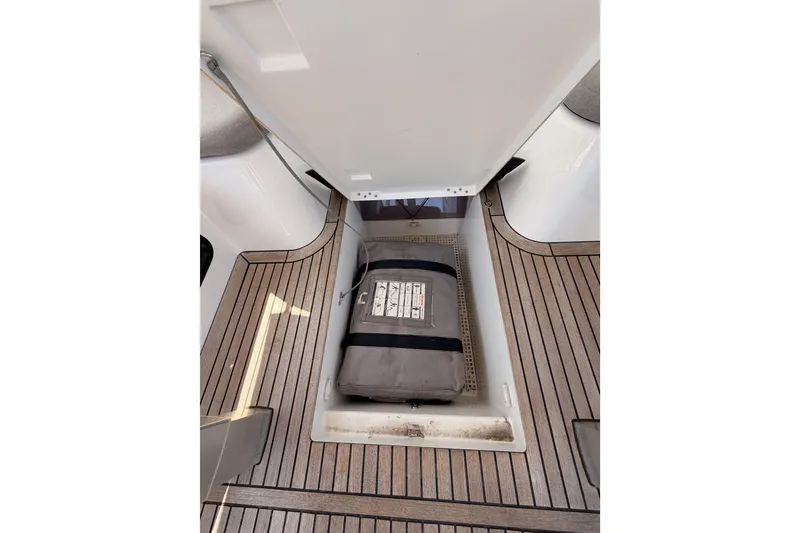 Slide: The Image of Storage compartment on 2022 Beneteau Oceanis Yacht 54 with wooden deck flooring. - 42