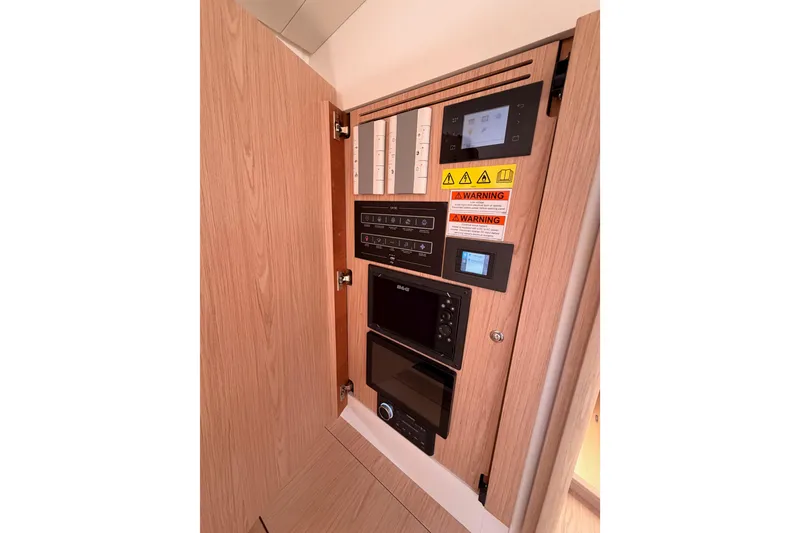 Slide: The Image of Control panel inside 2022 Beneteau Oceanis Yacht 54, featuring modern navigation and safety systems. - 71