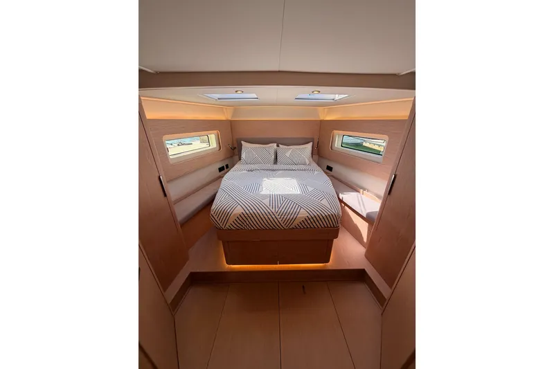 Slide: The Image of Luxurious cabin interior of 2022 Beneteau Oceanis Yacht 54 with modern design and cozy bedding. - 78