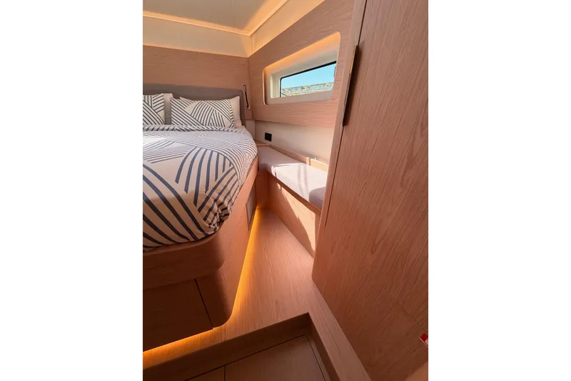 Slide: The Image of Luxurious cabin interior of 2022 Beneteau Oceanis Yacht 54 with modern design and ambient lighting. - 80