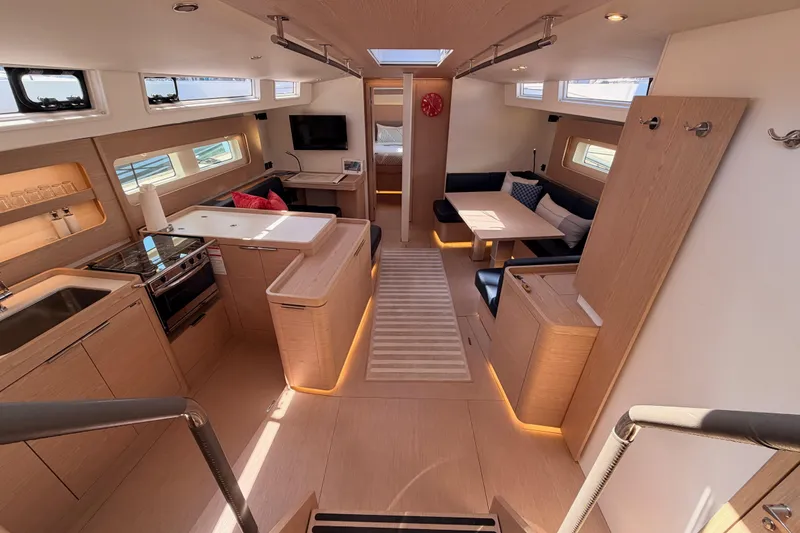 Slide: The Image of Luxurious interior of 2022 Beneteau Oceanis Yacht 54, featuring modern kitchen and seating area. - 44