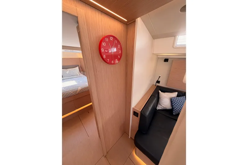 Slide: The Image of Interior of 2022 Beneteau Oceanis Yacht 54, featuring cozy seating and modern design elements. - 76