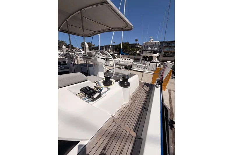 Slide: The Image of 2022 Beneteau Oceanis Yacht 54 docked, showcasing deck and helm details. - 32