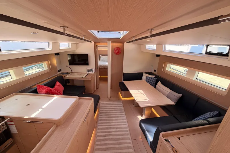 Slide: The Image of Luxurious interior of 2022 Beneteau Oceanis Yacht 54 with modern furnishings and ample natural light. - 68