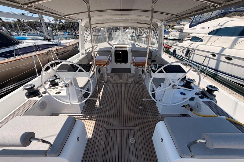 Slide: The Image of Spacious cockpit of 2022 Beneteau Oceanis Yacht 54 with dual steering wheels. - 33