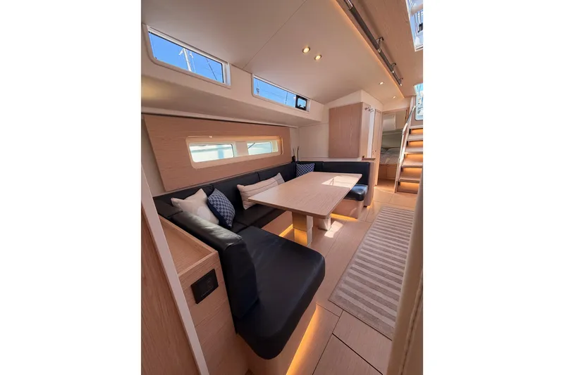 Slide: The Image of Luxurious interior of 2022 Beneteau Oceanis Yacht 54 with modern seating and elegant lighting. - 88