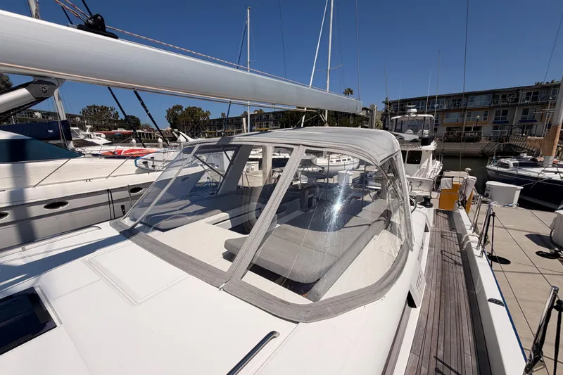 Slide: The Image of 2022 Beneteau Oceanis Yacht 54 docked, showcasing sleek design and spacious cockpit. - 30