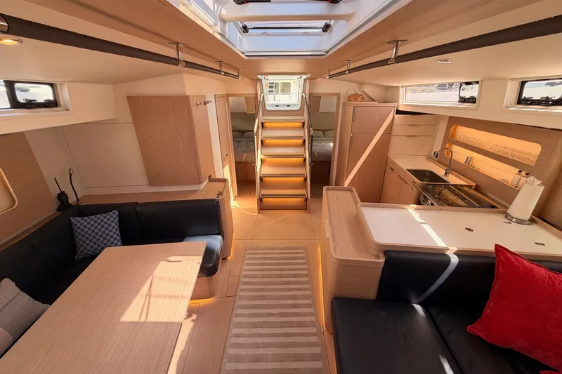 Slide: The Image of Luxurious interior of 2022 Beneteau Oceanis Yacht 54, featuring modern kitchen and seating area. - 89