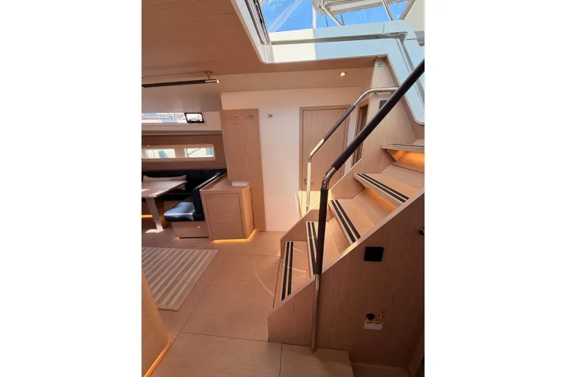 Slide: The Image of Luxurious interior of 2022 Beneteau Oceanis Yacht 54, featuring elegant wood finishes and modern design. - 60