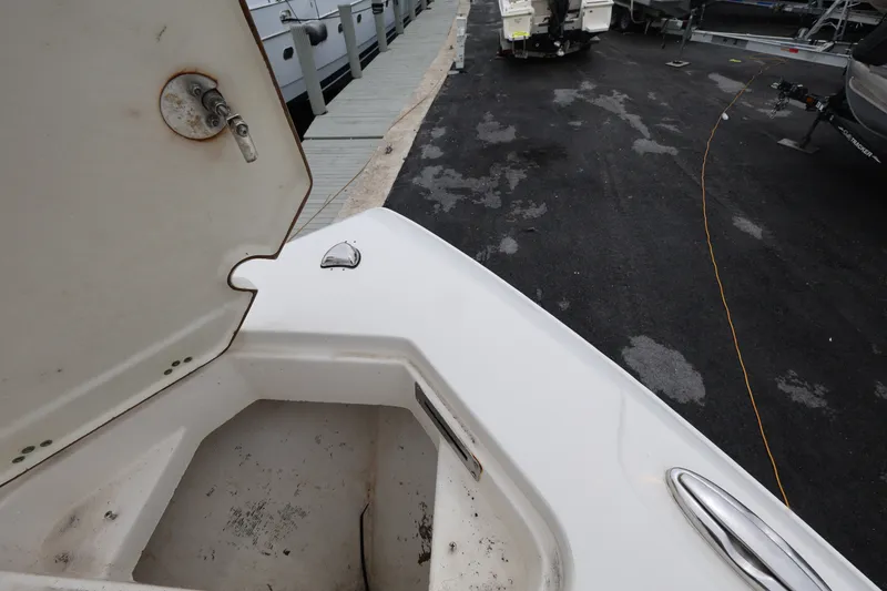 Slide: The Image of Open storage compartment on 2022 Sailfish 242 CC boat at dockside. - 14