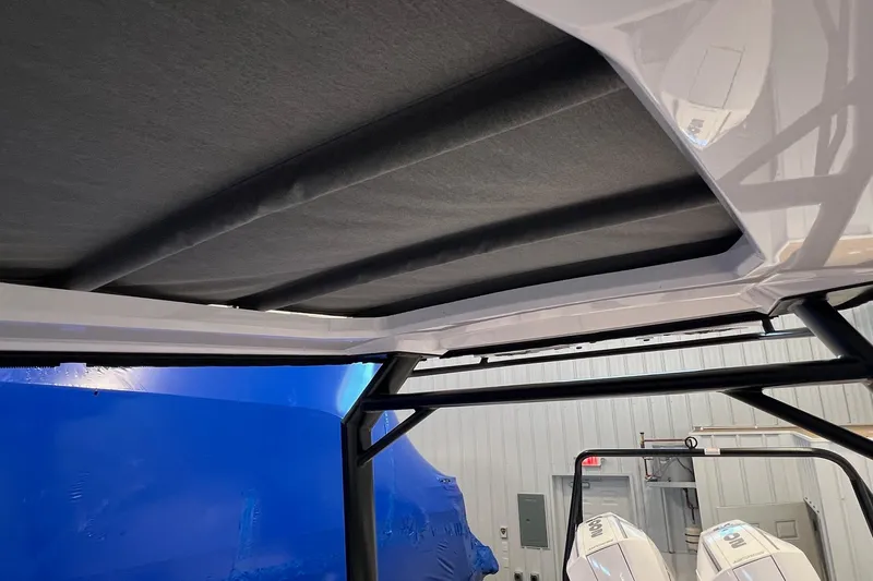 Slide: The Image of Interior view of 2027 Axopar 29 Sun-Top boat with sleek roof design. - 18