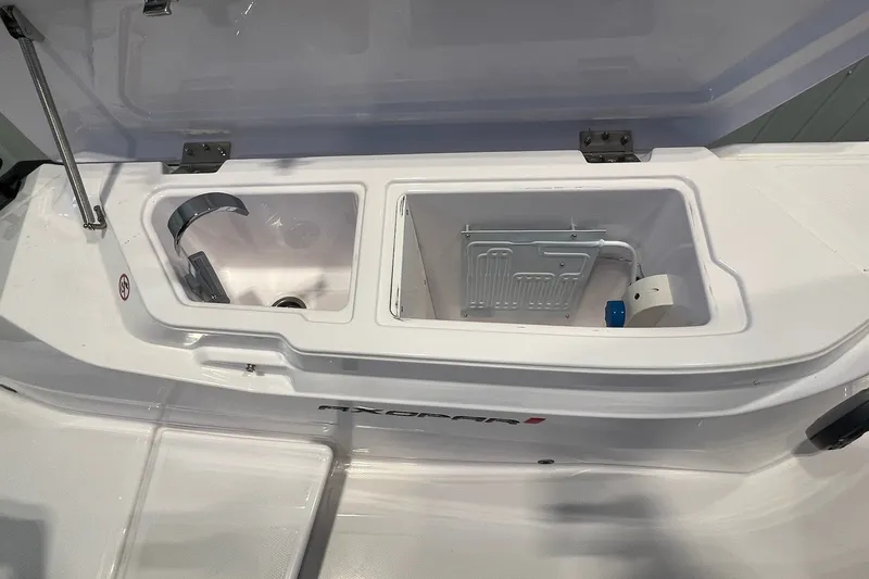 Slide: The Image of Storage compartments on a 2027 Axopar 29 Sun-Top boat, showcasing sleek design and functionality. - 16