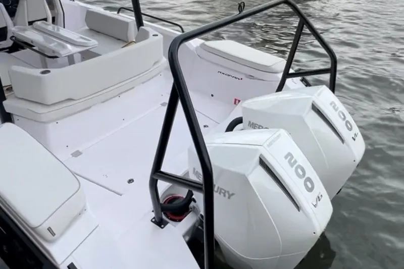 Slide: The Image of 2027 Axopar 29 Sun-Top boat with dual Mercury 200 engines on water. - 2