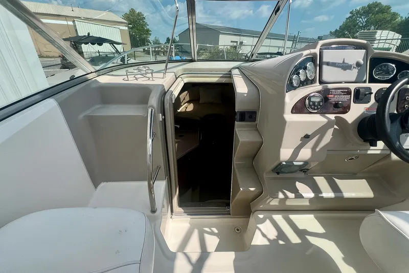 Slide: The Image of Interior view of 2007 Sea Ray 270 Amberjack boat cockpit with steering controls. - 22