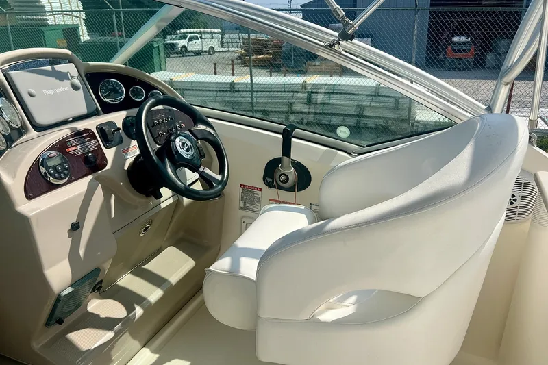 Slide: The Image of Interior cockpit of 2007 Sea Ray 270 Amberjack boat with steering wheel and controls. - 16