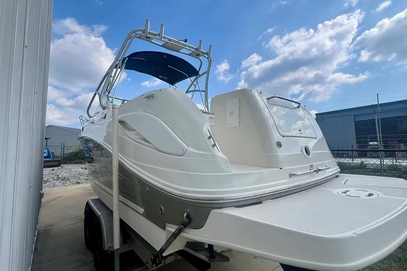 Slide: The Image of 2007 Sea Ray 270 Amberjack boat on trailer under blue sky. - 30