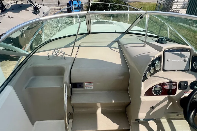 Slide: The Image of 2007 Sea Ray 270 Amberjack boat cockpit with steering console and navigation equipment. - 19