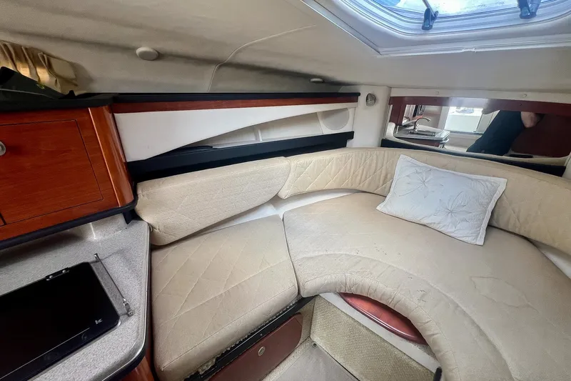 Slide: The Image of Cozy cabin interior of 2007 Sea Ray 270 Amberjack with plush seating and skylight. - 26