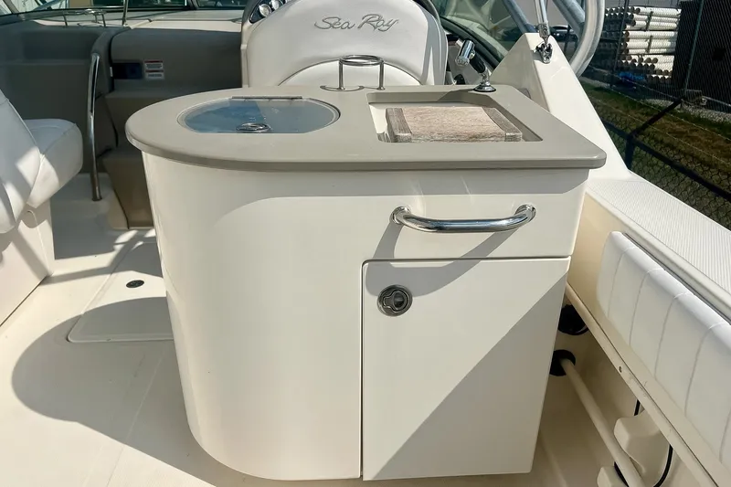 Slide: The Image of 2007 Sea Ray 270 Amberjack boat interior with sink and storage cabinet. - 12