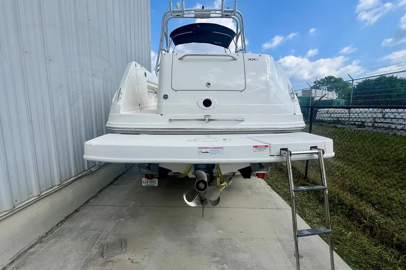 Slide: The Image of 2007 Sea Ray 270 Amberjack boat, rear view with swim platform and ladder. - 4