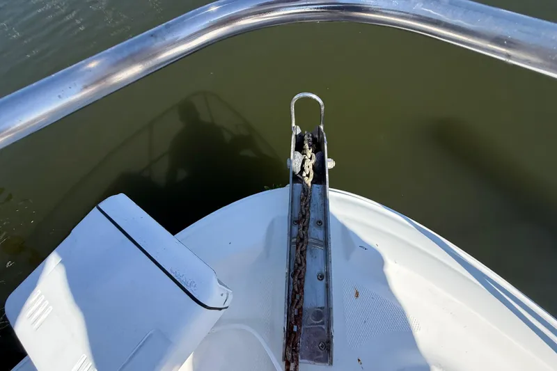 Slide: The Image of Bow view of 2008 Sea Ray 38 Sundancer with anchor chain over water. - 13