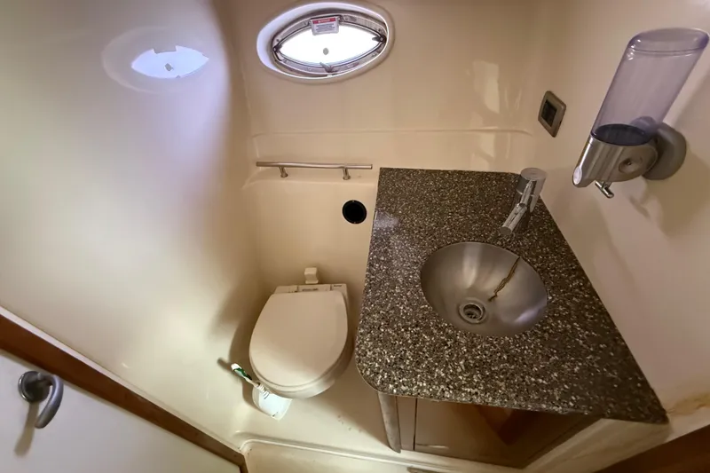 Slide: The Image of Compact bathroom in 2008 Sea Ray 38 Sundancer yacht with sink and toilet. - 54