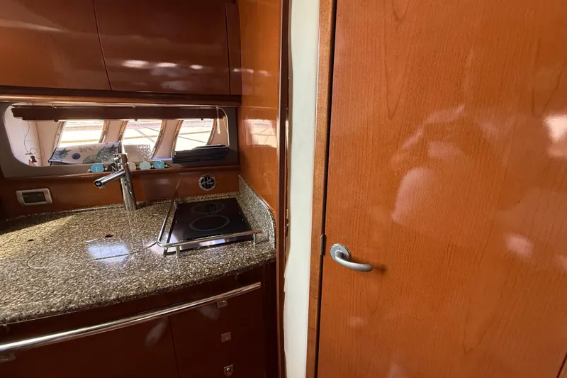 Slide: The Image of Luxurious 2008 Sea Ray 38 Sundancer yacht interior with sleek kitchen design. - 89