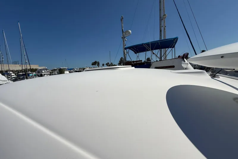 Slide: The Image of 2008 Sea Ray 38 Sundancer yacht docked at marina under clear blue sky. - 27
