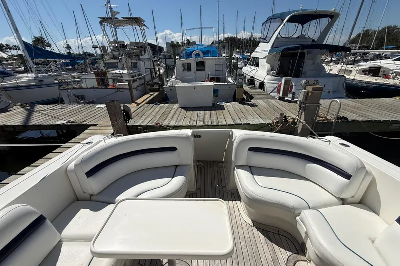 Slide: The Image of 2008 Sea Ray 38 Sundancer yacht interior with white seating at marina dock. - 134