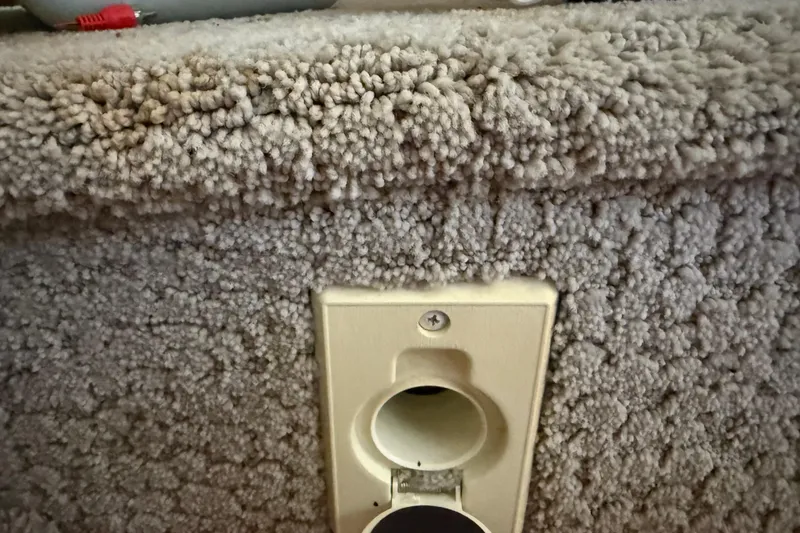 Slide: The Image of Carpeted interior detail of a 2008 Sea Ray 38 Sundancer boat. - 83