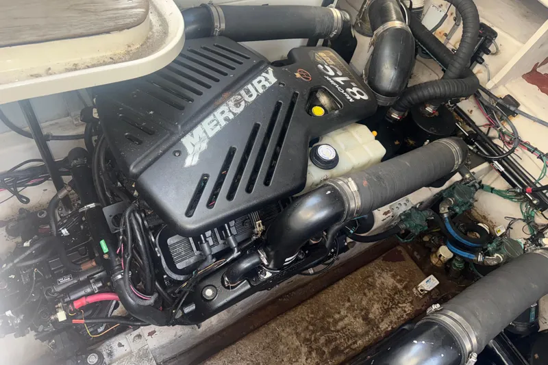 Slide: The Image of Engine compartment of a 2008 Sea Ray 38 Sundancer with a Mercury 8.1S motor. - 141