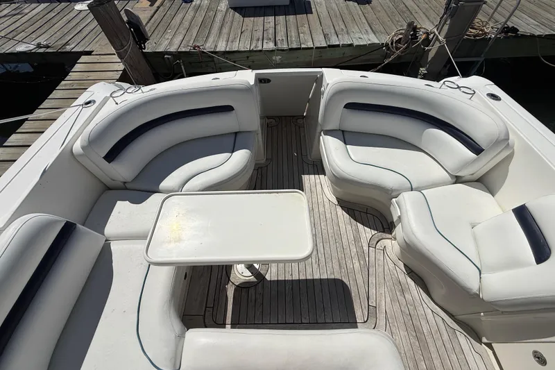 Slide: The Image of Luxury seating area on a 2008 Sea Ray 38 Sundancer yacht, docked at a marina. - 132