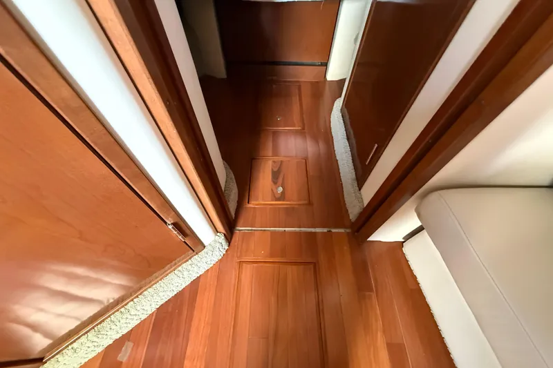 Slide: The Image of Interior view of 2008 Sea Ray 38 Sundancer with polished wooden flooring. - 64