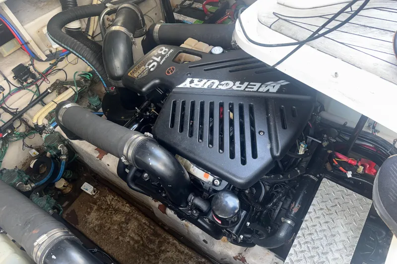 Slide: The Image of Engine compartment of a 2008 Sea Ray 38 Sundancer with MerCruiser engine. - 142