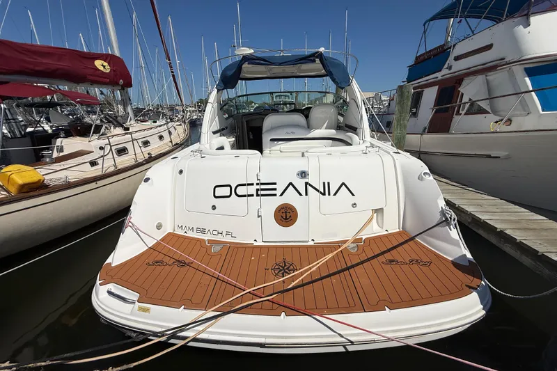 Slide: The Image of 2008 Sea Ray 38 Sundancer yacht docked, featuring "Oceania" name and Miami Beach, FL location. - 1