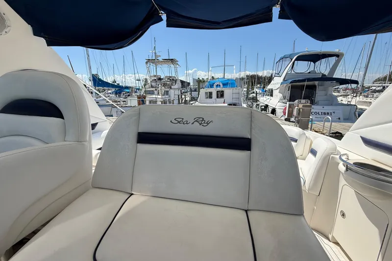 Slide: The Image of 2008 Sea Ray 38 Sundancer yacht interior with marina view, featuring luxurious seating. - 113