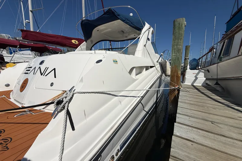 Slide: The Image of 2008 Sea Ray 38 Sundancer yacht docked at marina, side view with clear sky. - 3