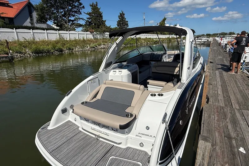 Slide: The Image of 2013 Formula 310 Bowrider docked by a wooden pier on a sunny day. - 13