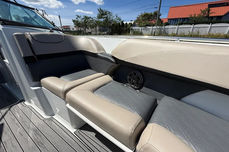 Slide: The Image of Luxurious seating on 2013 Formula 310 Bowrider boat, featuring elegant upholstery and speaker system. - 48