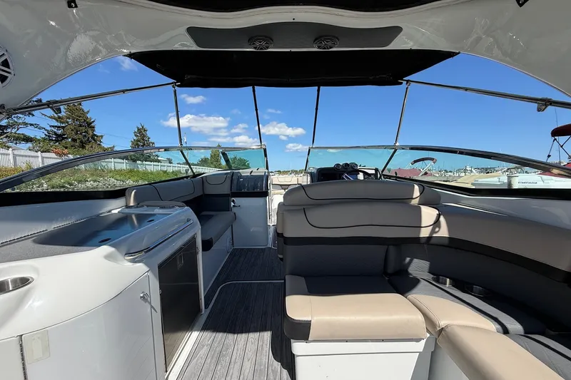 Slide: The Image of Interior of a 2013 Formula 310 Bowrider boat with seating and kitchenette. - 17