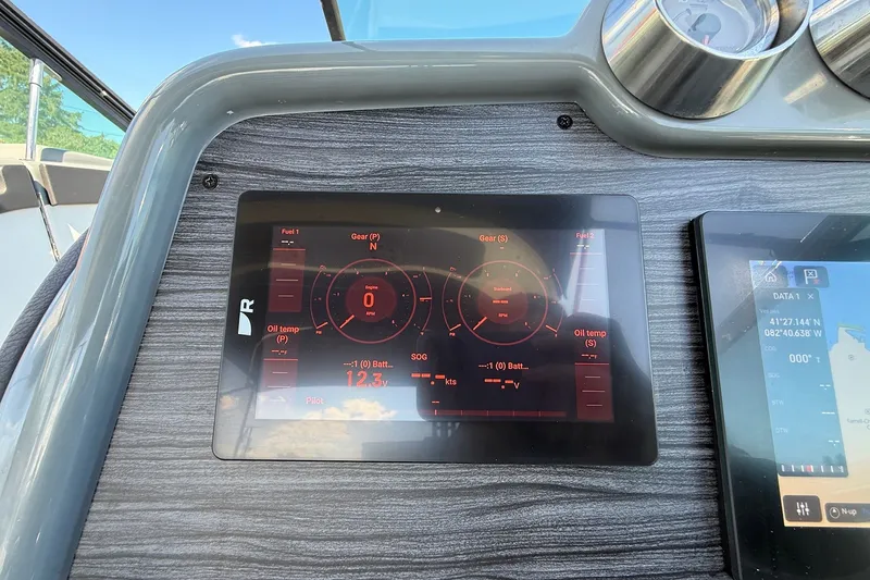 Slide: The Image of Dashboard of a 2013 Formula 310 Bowrider boat with digital displays. - 35