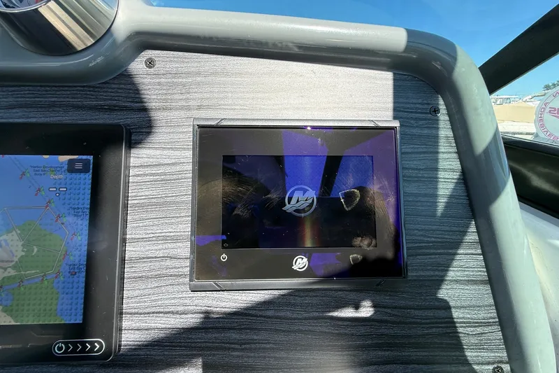 Slide: The Image of Dashboard of a 2013 Formula 310 Bowrider boat with navigation display. - 36