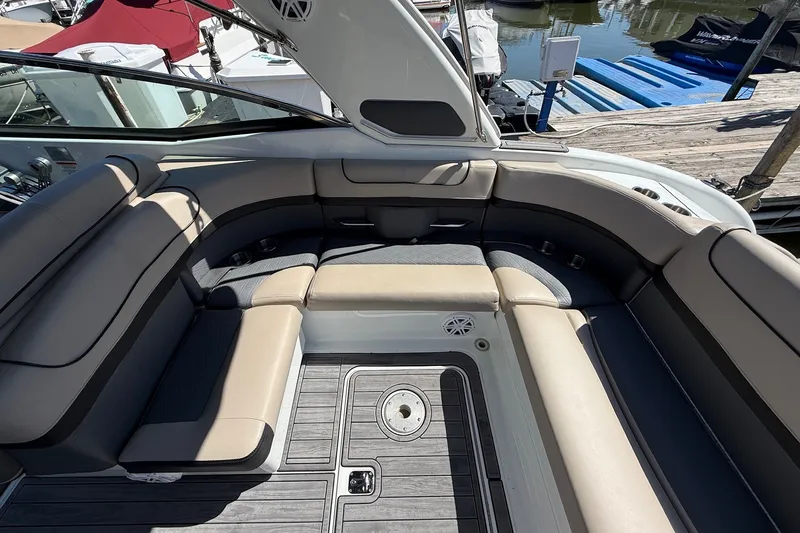 Slide: The Image of 2013 Formula 310 Bowrider interior with spacious seating and sleek design. - 18