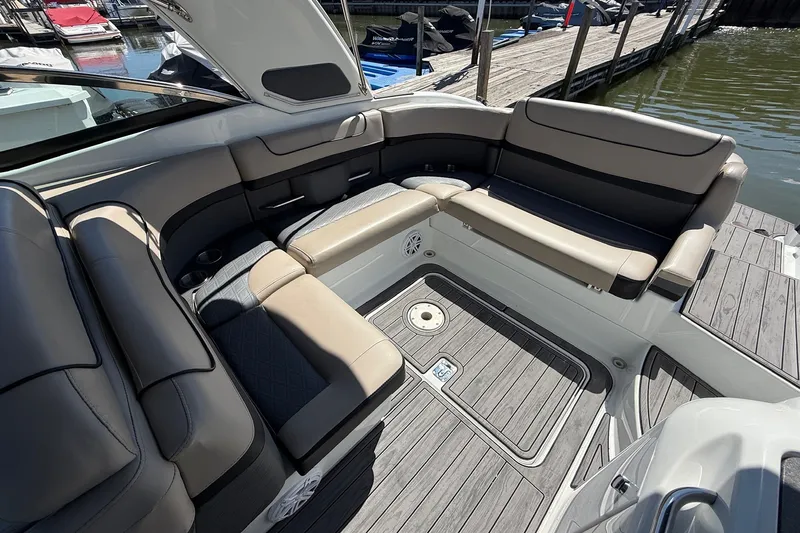 Slide: The Image of 2013 Formula 310 Bowrider boat interior with spacious seating and elegant design. - 21