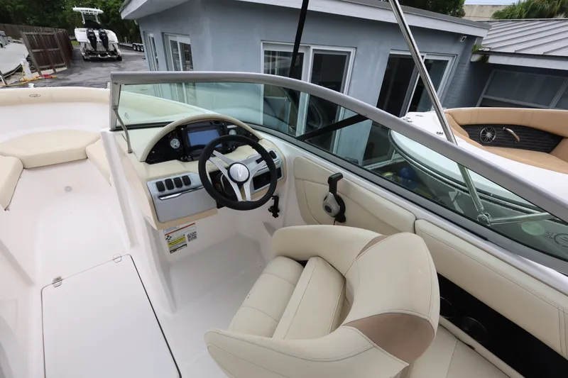Slide: The Image of Interior view of 2020 Regal 21 OBX boat with steering wheel and seating. - 10