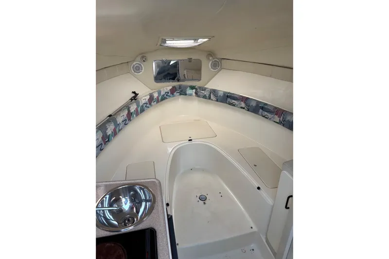 Slide: The Image of Interior of a 1997 Donzi 255 LXC boat with sink and seating area. - 21