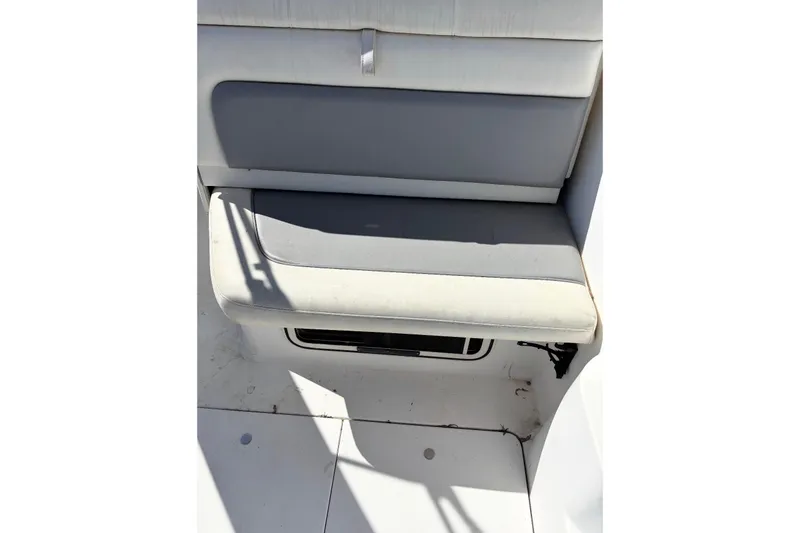 Slide: The Image of 1997 Donzi 255 LXC boat seat with gray and white upholstery. - 14