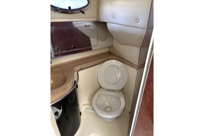 Slide: The Image of 1997 Donzi 255 LXC boat bathroom with toilet and sink. - 17