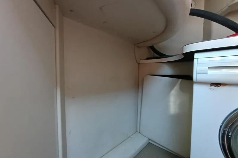 Slide: The Image of Interior view of 1997 Sea Ray 370 Aft Cabin with built-in appliances. - 83