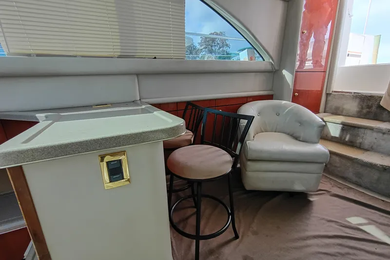 Slide: The Image of Interior of 1997 Sea Ray 370 Aft Cabin with seating and counter. - 53
